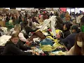 Bargain Hunters Find Discounted Designer Clothes at Bin Sale
