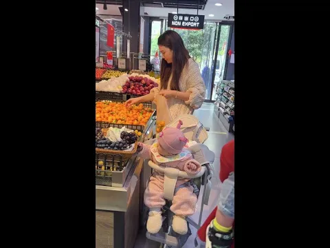 The child is quiet, but surely is causing trouble. Now the mother feels embarrassed.