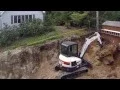 Lagu Bobcat E45 Digging Up Big Stump
