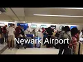 Newark Airport Terminal C Self-Check-In Area walking EWR Airport United Airlines New York