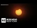 Partial solar eclipse compels many in NYC area to look up into the sky