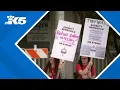 Everett Herald employees protesting layoffs that cut nearly half its newsroom staff