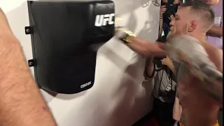 Conor McGregor 4 punches full reach about in 0 55 seconds twisting his waist each time