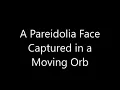 A Pareidolia Face Captured in a Moving Orb