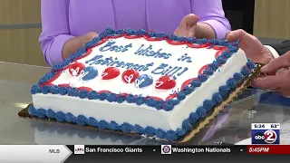 Presenting Bill Jartz with a cake and caricature to celebrate his retirement