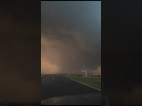 Incredible tornadic supercell glowing orange west of Harvey, North Dakota!