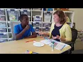 Example A tutor uses fraction tiles to demonstrate showing fractions