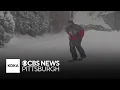 Pittsburghers enjoy the heavy snowfall blanketing western Pennsylvania