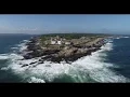 Waves crashing at Beavertail Lighthouse Jamestown RI 4K Drone