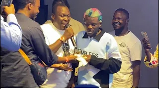 portable surprised remi aluko on stage at billique music and comedy concert