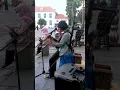 Download Lagu I never thought a unique busker would play two musical instruments.