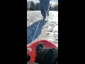Ebike pulling a sled in the snow