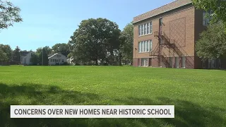 Neighbors upset over proposed housing near Davenport historic school building