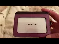 Coach zip card case in color block and retro signature bracelet