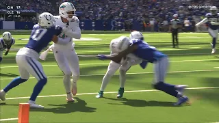 DeVon Achane bounces off a defender to get into the endzone