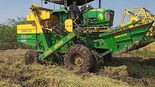 harvesting paddy john deere tractor