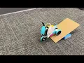 Custom Bike coded in Python being tested on an obstacle course in Python Lego Robotics Summer Camp