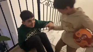 Little brother playing with the cat !