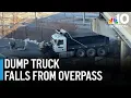 Dump truck falls off Boston overpass