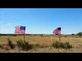 Flags stand at the site of the Salado Apache crash to honor the soldiers who lost their lives