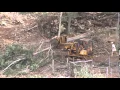 John Deere 450 Clearing land in Maui