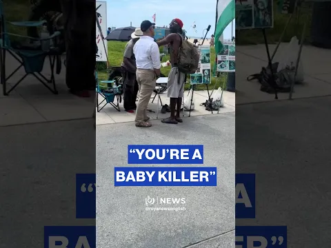 Pro-Palestinian protester confronts man disrupts “Stop Killing Children in Gaza” banner
