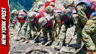 Chinese Rescue Crews Trudge Through Treacherous Terrain For Survivors
