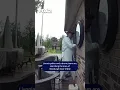 A suspect dressed in a hazmat suit was caught on camera in Livonia attempting to enter a home
