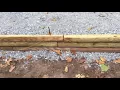 INSTALLING A WOODEN RETAINING WALL