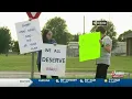 Protesters gather at post office open house