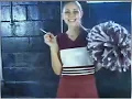Brunette cheerleader smoking a long Newport 100 menthol