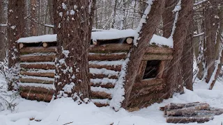 building a warm winter shelter for survival in the wild woods winter bushcraft asmr