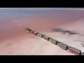 Download Lagu Train Travels Across Stunning Pink Salt Lake