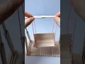 make a swing out of ice cream sticks