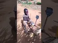 Download Lagu Little boy plays his homemade drum set.