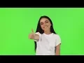 Happy Beautiful Woman Showing Thumbs Up on Green Background Stock Footage - hive