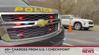 Pinebluff checkpoint leads to 2 arrests over 40 charges