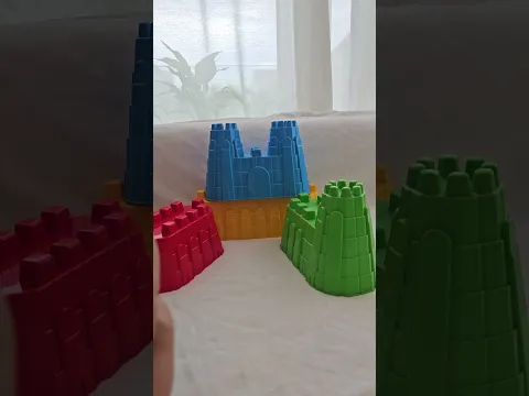 Baby Born and a colorful stacking pyramid for toddlers