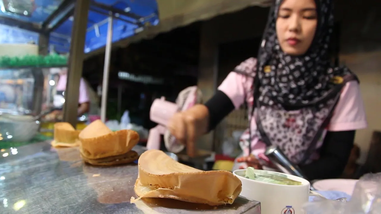 Cooking Thai Street Food: Street Food Vendors in Thailand. Shopping at a Thai Food Market