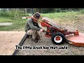 Mowing the food forest with our Gravely walk behind brush hog
