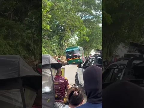 Bus Tilted Off Narrow Roadway