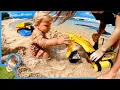 Download Lagu First time Digging With Toy Construction Trucks at the Beach
