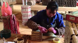 INSIDE A FIREWORK FACTORY WORKER MAKING CAKES 