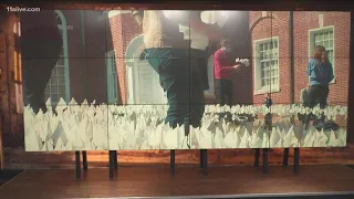 Covid deaths painted with white flags outside of Decatur church