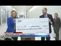I M gives rebate check to EACS