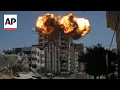 Lagu Israel destroys buildings in Gaza City after warning residents to leave