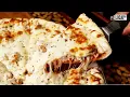 Chicago area pizza pub puts a twist on deep dish by serving up a double decker pie