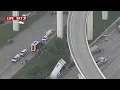 18-wheeler dangles over freeway on Katy Freeway