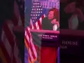 Jen Psaki hoop earrings and face mask
