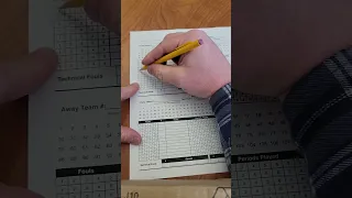 Filling out a Basketball score sheet